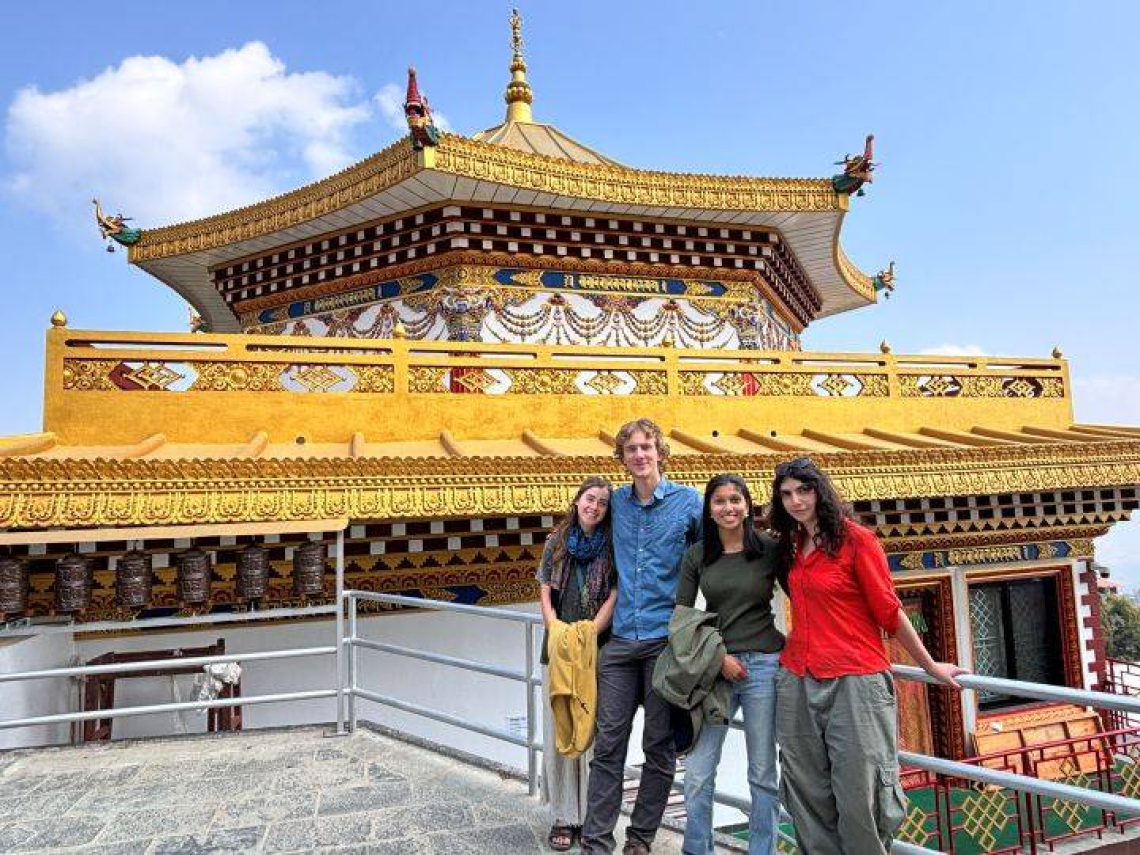 students at temple.jpg Researchers stand in front of temple
