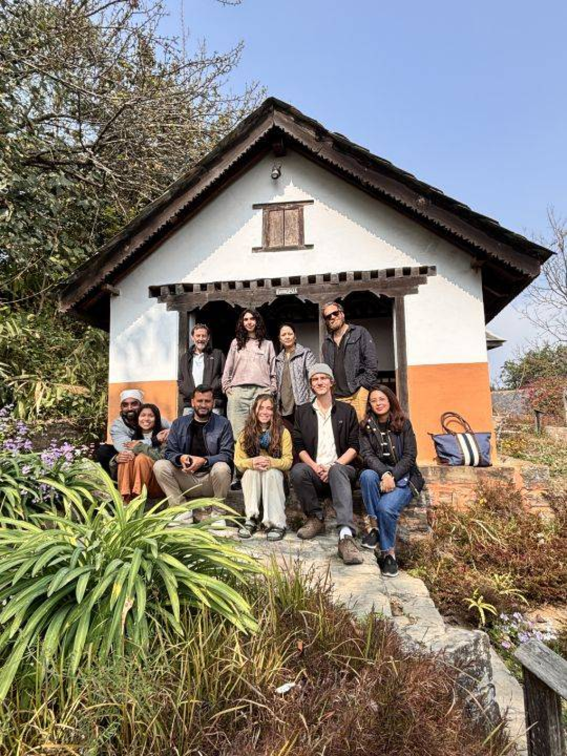 Students at house.jpg Student researchers in front of house