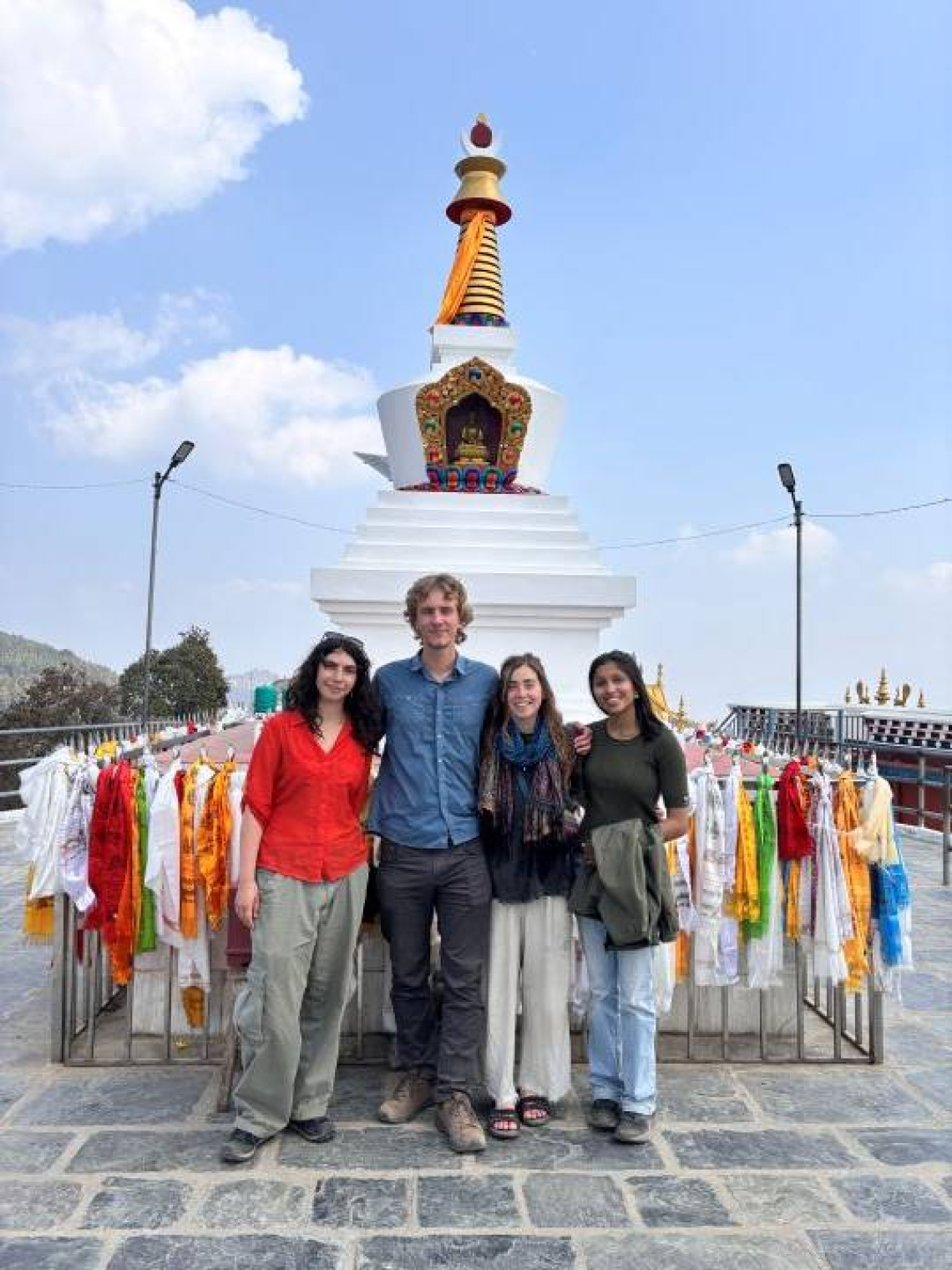 students at monument.jpg Researchers standing in front of monument